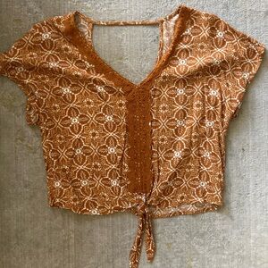 Stylish cropped top with tie front in mustard yellow